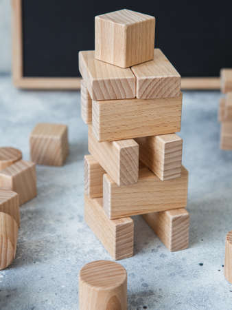 Wooden Toy Construction with ecologically wooden blocks manufactured from sustainable timbers. Wood elements for kids mental development and education. Montessori toysの写真素材