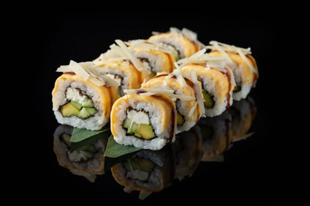 Traditional delicious fresh sushi roll set on a black background with reflection. Sushi roll with...