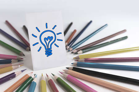 colored pencils around idea card with clipping path, easily to change color of light bulb.の写真素材