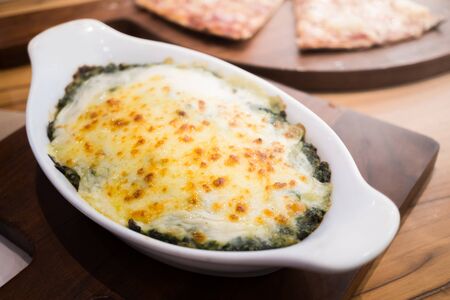 Baked spinach with cheeseの写真素材