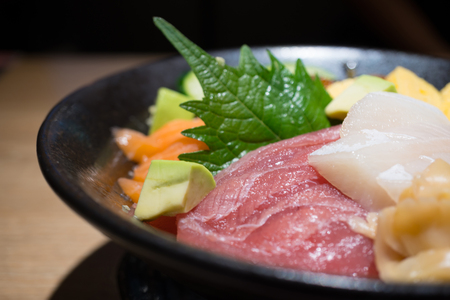Fresh sashimi set in black bowlの写真素材