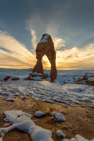 This is the picture of Delicated Arch with snow during sunset at Arches National Park, Utah.の写真素材