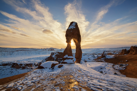 This is the picture of Delicated Arch with snow during sunset at Arches National Park, Utah.の写真素材