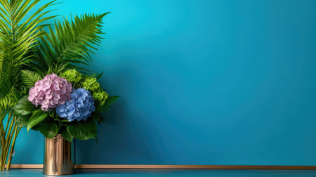 Vibrant blue background with rose-gold frame holding hydrangea and fern bouquetの素材