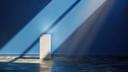 Dim blue room with clean pedestal under focused spotlight, modern gallery feel with deep shadowsの素材