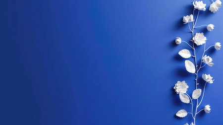 Elegant blue background decorated with white floral elements and leaves, minimalist botanical designの素材
