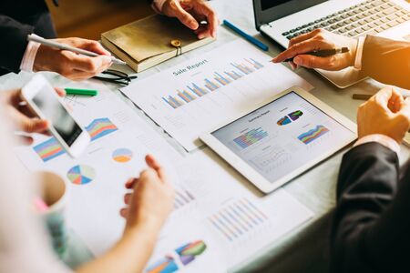 businessman investment consultant analyzing company financial report balance sheet statement working with documents graphs. Concept picture for stock market, office, tax,and project.の写真素材
