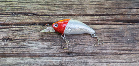 Colorful Fishing Lures on wood desk different fishing baitsの写真素材