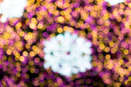 Lights blurred bokeh background from christmas night partyの写真素材