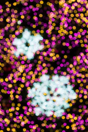 Lights blurred bokeh background from christmas night partyの写真素材