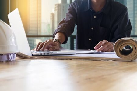 Young man working on his plane project at office.の写真素材
