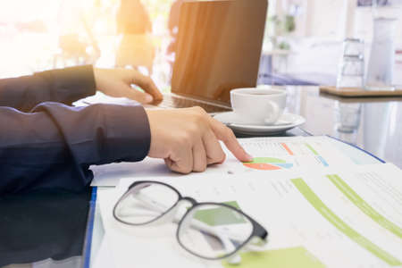 business man discussing documents and using comupter laptop