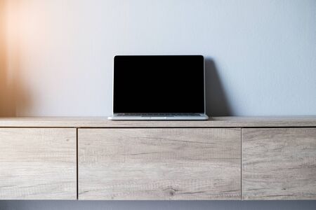 Laptop with blank screen on table.の写真素材