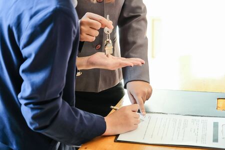 Real estate agent offer hand for customer sign agreement contract signature for buy or sell house.