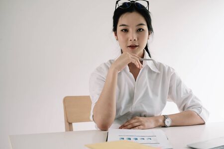 Portrait Of Attractive Asian Businesswoman Working On Laptop for marketing planの写真素材