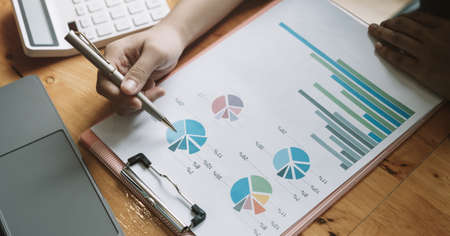 Close up a man working about financial with calculator at his office to calculate expenses, Accounting conceptの写真素材