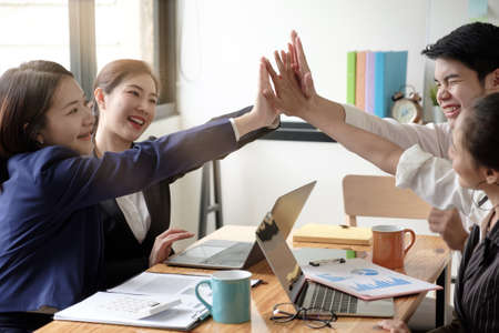 Successful entrepreneurs, Business colleagues celebrating successful at officeの写真素材