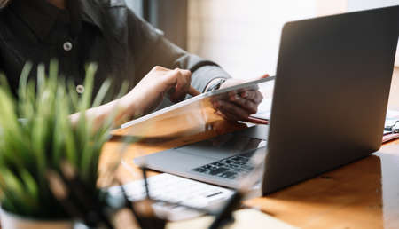 Close up a accountant working about financial at office to calculate expenses, Accounting conceptの写真素材
