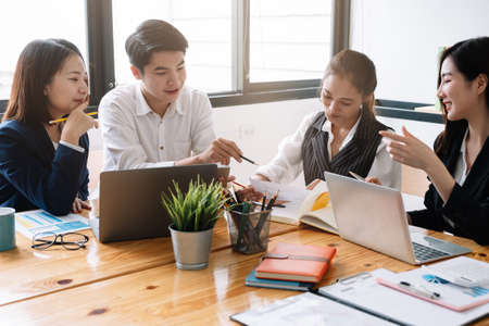 Asian business adviser meeting to analyze and discuss the situation on the financial report in the meeting room.Investment Consultant,Financial Consultant,Financial advisor and accounting conceptの写真素材