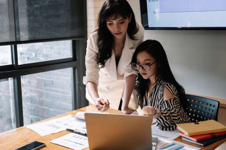 Close up business People Meeting to analyse and discuss and brainstorming the financial report chart data, Financial advisor teamwork and accounting conceptの写真素材