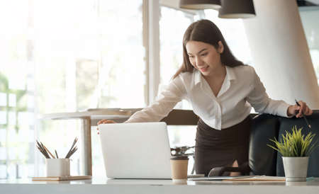 Young asian woman working laptop for business or online learning.の写真素材