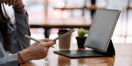 Audit concept,Bookkeeper or financial inspector and secretary making report Financial Planning Report in Spreadsheet .Internal revenue Service inspector checking financial documentの写真素材