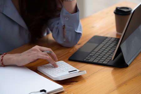businessman working using calculator with laptop in office - accounting concept.の写真素材