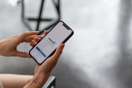 CHIANG MAI, THAILAND - APR 4, 2021: iPhone 12 with LinkedIn application on the screen. LinkedIn is a business-oriented social networking serviceのeditorial素材