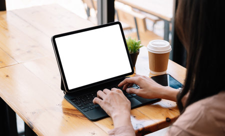 Business woman talking about sale report in video conference. Asian team using laptop and tablet online meeting in video call.Working from home, Working remotely and Social isolationの写真素材