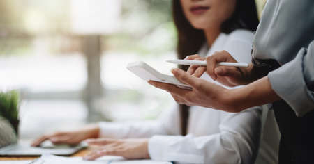 Close up Business people meeting to discuss the situation on the market with calculator. Business...