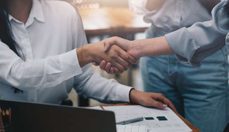 Close up of Business people shaking hands, finishing up meeting, business etiquette, congratulation, merger and acquisition conceptの写真素材