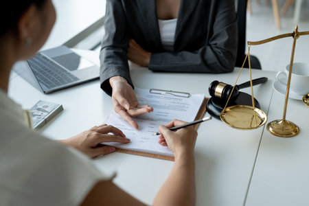 Businesswoman and lawyer discuss the contract document. Treaty of the law. Sign a contract business.の写真素材