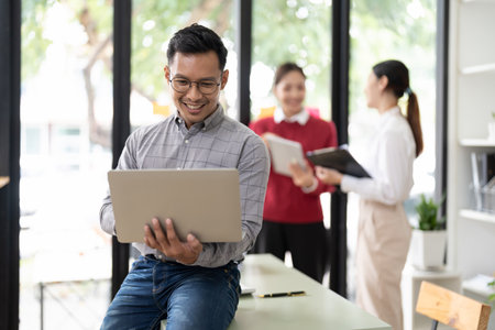 Portrait asian businessman using laptop computer in meeting room.の写真素材