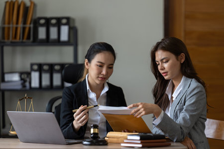 Businesswoman and female lawyer consult having team meeting with client, Law and Legalの写真素材