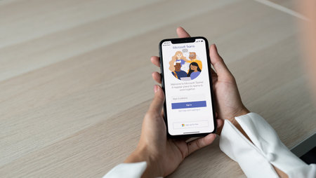 CHIANG MAI, THAILAND - SEP 8, 2022 : A working from home employee is downloading the Microsoft Teams social platform, ready for remote working in isolation from homeのeditorial素材