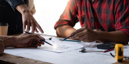 Team engineer man working with laptop and inspection for architectural plan,sketching a construction...