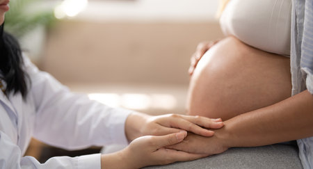Healthcare, pregnancy and hands of doctor with pregnant woman for support, comfort and compassion....