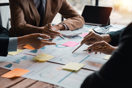 Business people meeting business consulting brainstorming project analysis report check investment. Marketing plan researching. Paperwork on the table.の写真素材