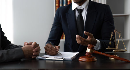 Consultation and conference of Male lawyers and businesswoman working and discussion having at law firmの写真素材