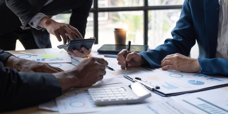 Business team meeting for paperwork discussion and analysis data chart and graph, finance and accounting. Business performance conceptの写真素材
