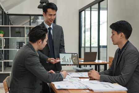 Close up of business people gather brainstorm discuss financial statistics at office meeting. finance, teamwork, Big data Graphs Charts conceptの写真素材