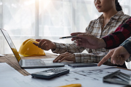 engineer team working in office with blueprints, inspection in workplace for architectural plan on laptop, construction project ,Business constructionの写真素材