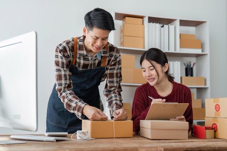 startup small business owner working with computer at workplace. freelance man and woman seller...