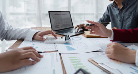 business team discussion of reports displayed in charts and graphs. analyze financial statistics...
