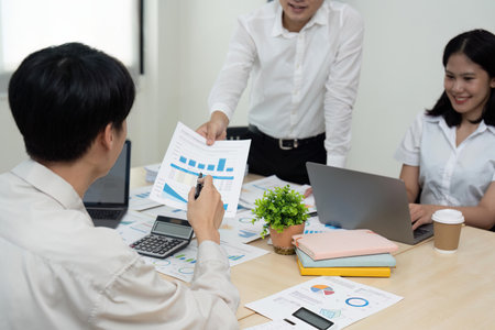 Business team people discussing analyzing investment charts the charts and graphs showing the...