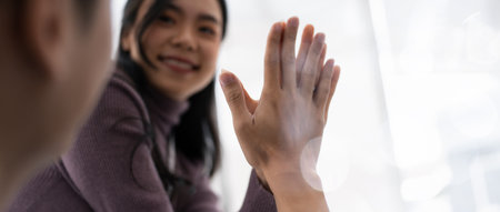 business team people give high five happy excited in teambuilding celebrate corporate teamwork...