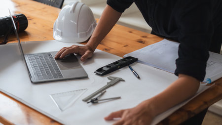 Architect engineer design working on blueprint planning conceptの写真素材