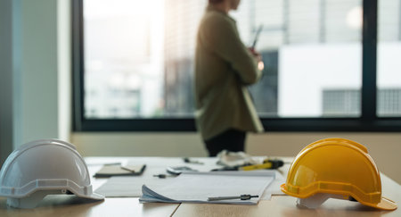 Engineer working wear worker helmets hardhat on construction siteの写真素材