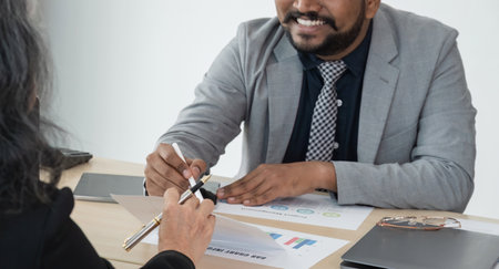 Diverse, different nationalities business team discuss work, meeting and strategy in planning, team discussion at office. Collaboration or discussing project plan in conference at workplaceの写真素材