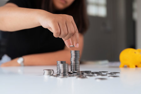 Business women put coin stack money and many bank note in office, Save money for future and...